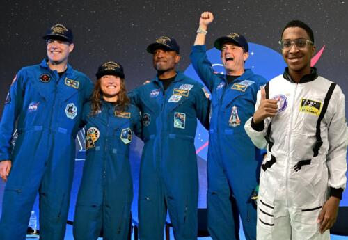 Green screen photo of student with Artemis II astronauts