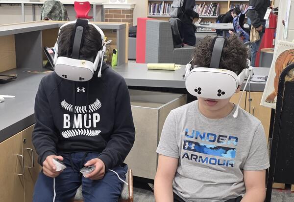 Students using Meta Quest 3 virtual reality headsets
