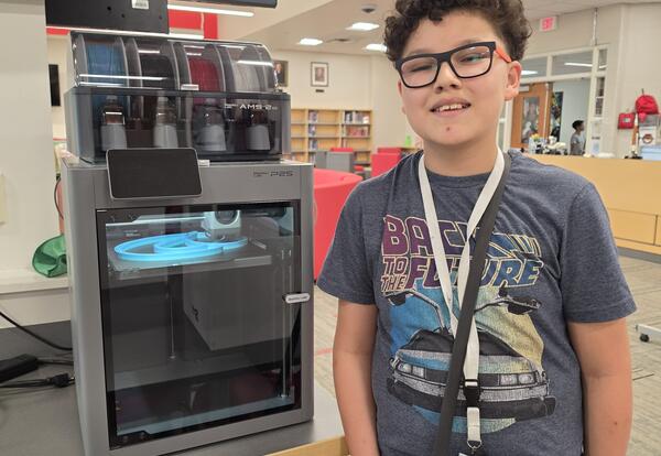 Student with new 3D printer