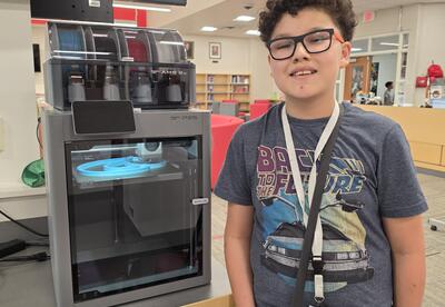 Student with new 3D printer