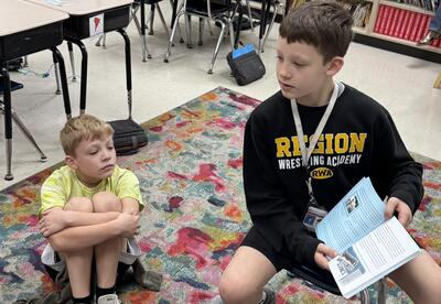 Students reading a book.