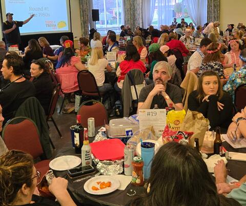 Large Group gathered indoors for trivia night