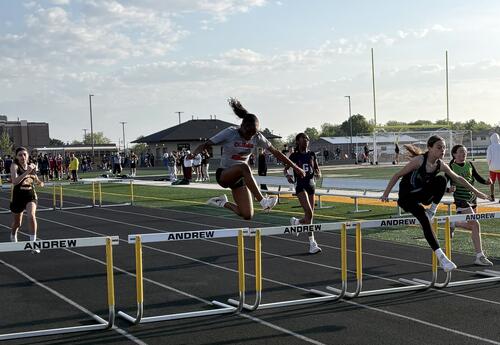 Aubree C clears the hurdles at the SWIC Conference Track Meet