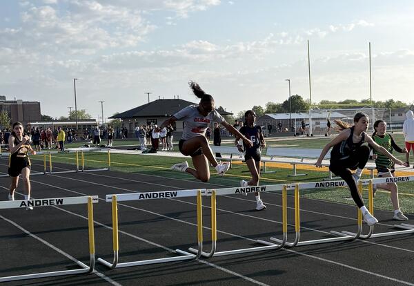 Aubree C clears the hurdles at the SWIC Conference Track Meet