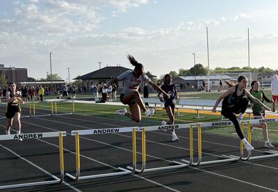 Aubree C clears the hurdles at the SWIC Conference Track Meet