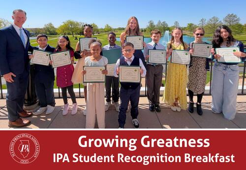 Students holding awards with the Superintendent outdoors.