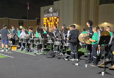 OLHMS, Simmons, and OLCHS bands come together to play at the OLCHS football game