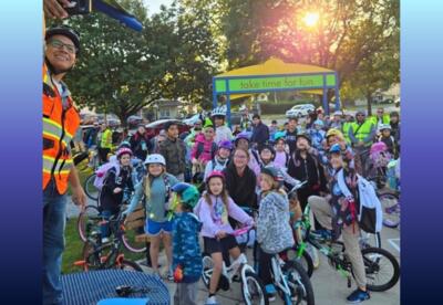 Students riding their bikes to school.