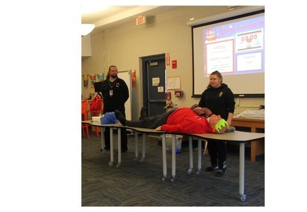 Mr. Bowen lying on a table