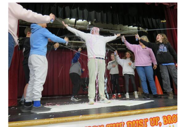 Mr. Campo being sprayed with silly string