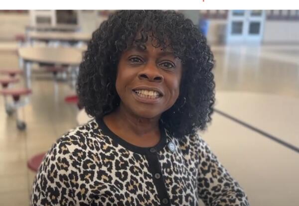 Lady smiling in cafeteria