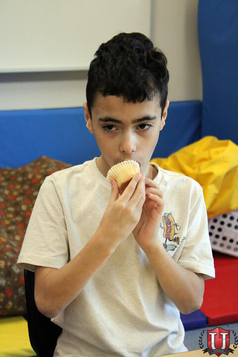 Student eats cupcake