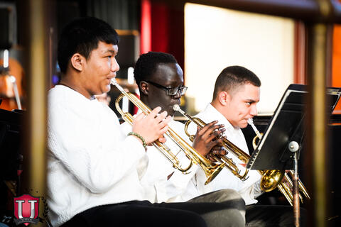 Group of students playing the trumpet