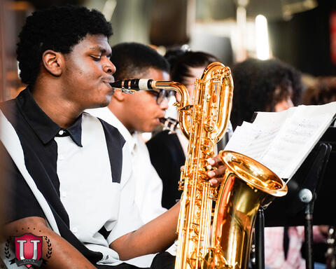 Student playing the bass saxophone