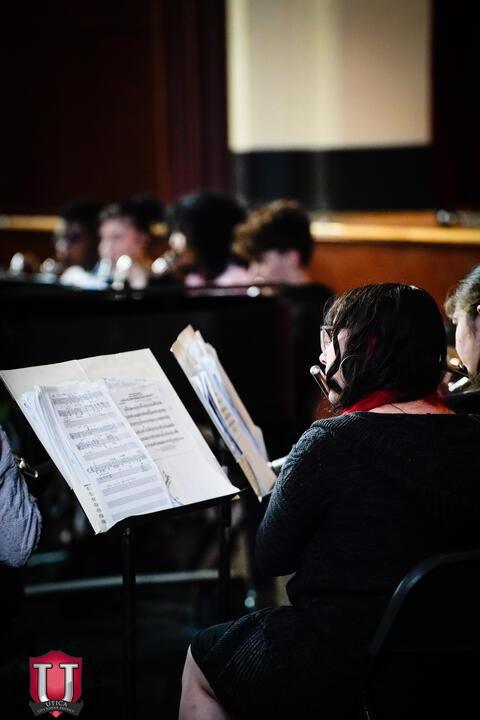 Student reading sheet music