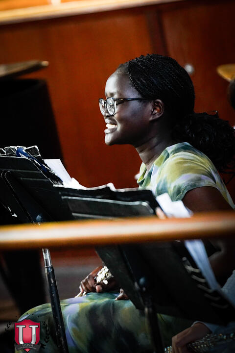 Student smiling while waiting to play