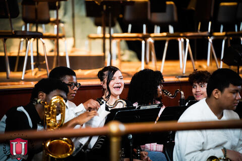 Student laughing in between songs