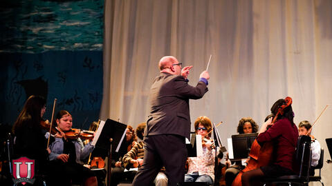 Conductor leading the band