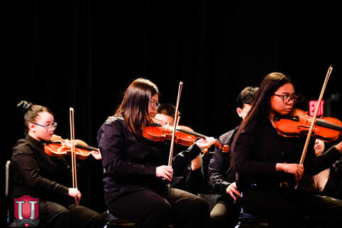 Student playing the violin
