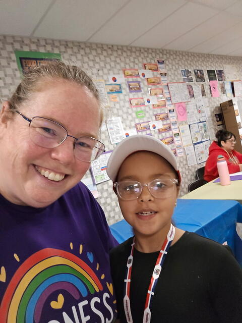 Student Posing with staff