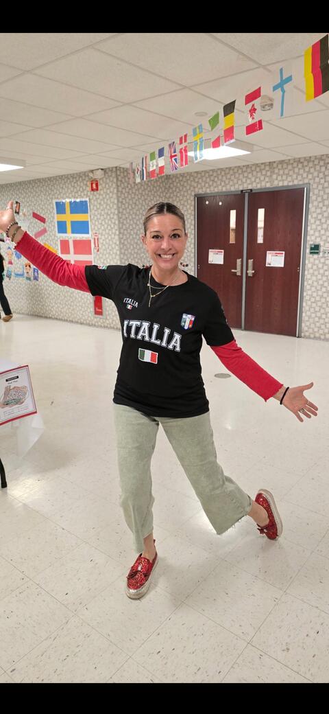Staff posing happily with their italy shirt