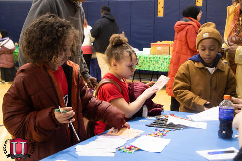 Student working on a project on a table