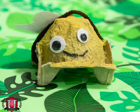 Arts and Crafts of a hat with a googly eye face