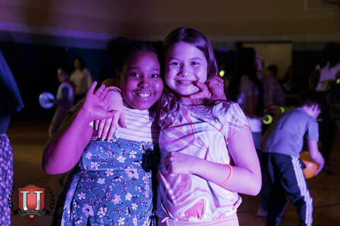 Students posing happily at dance