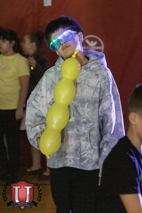 Student wearing a balloon on his shoudlers