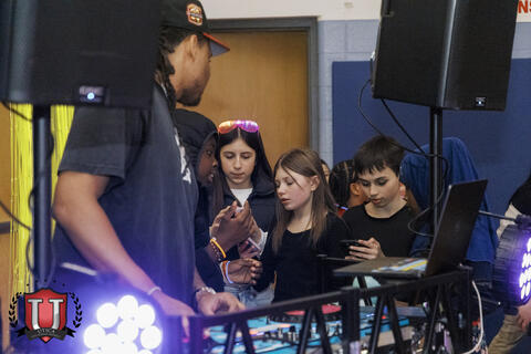 Students asking the DJ for song choices