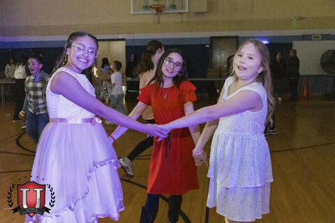 Students posing holding hands