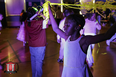 Student posing with her string 