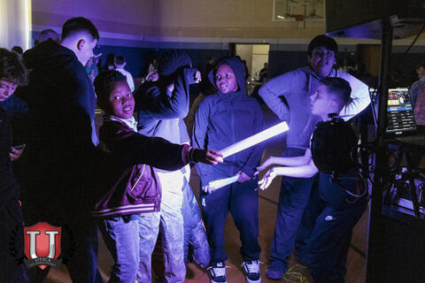 Students posing with their light sticks