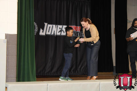 Student accepting award on stage