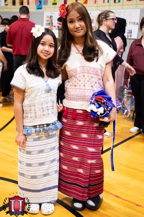 Staff and student pose together