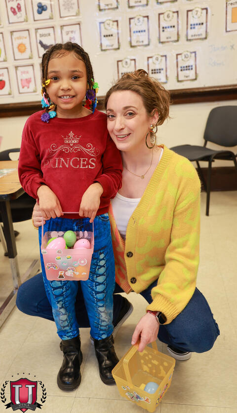 Student posing with staff with egg basket