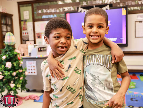 Two students posing and hanging 