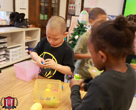 Students playing with easter eggs