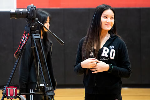 CTE Student smiling while waiting for students to show up
