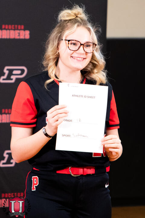 Student posing with their bio smiling