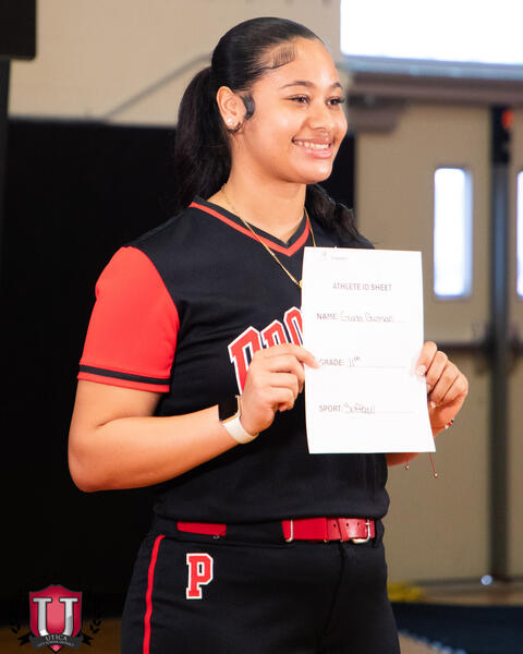 Student smiling while holding her bio form