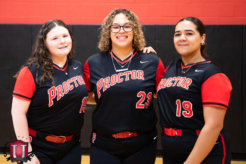 Students posing with arms around shoulders