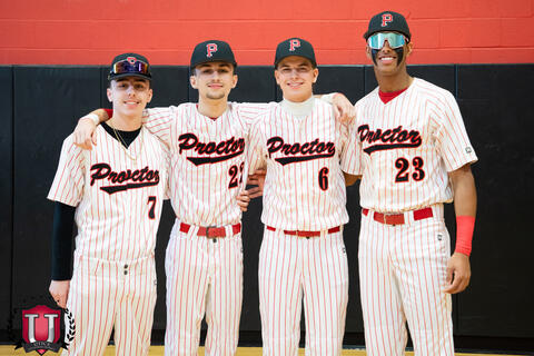Group of baseball boys posing with arms around shoulders