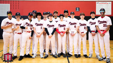 Baseball team standing posing with their arms crossed in front of them