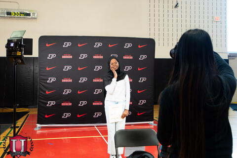 Student posing in a sleepy head position