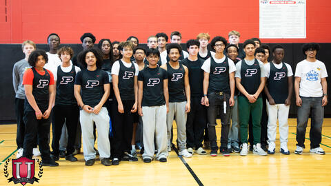 Mens track posing together