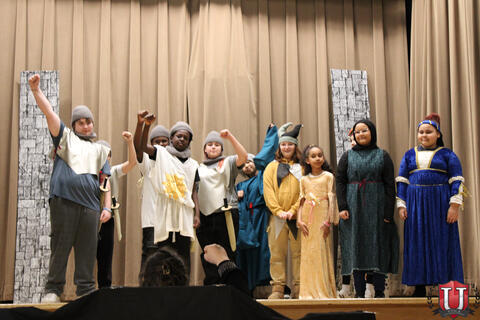 Students posing after play