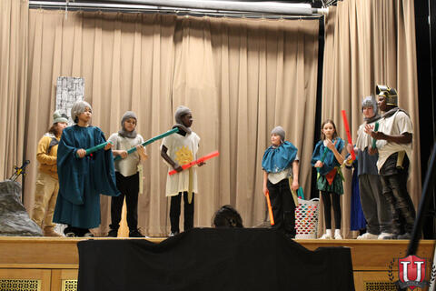 Students acting in play
