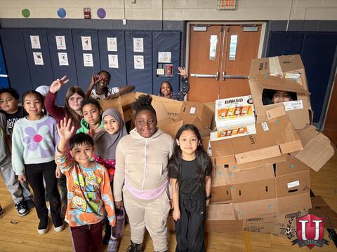 Students posing with their boxes