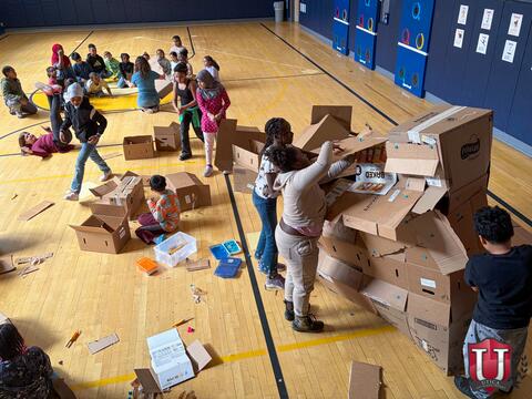 Overhead shot of all of the students working on their box
